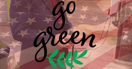 Multiple exposure of go green text over american flag with businessman at electric charging station. digital composite of environmental conservation and identity.の写真素材