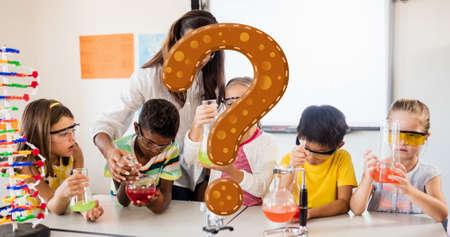 Digital composite of question mark over teacher assisting students in science experiment in class. education and knowledge.の写真素材
