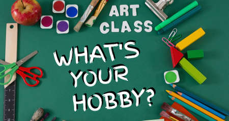 Composition of what's your hobby text with art supplies and apple on green table. national hobby...