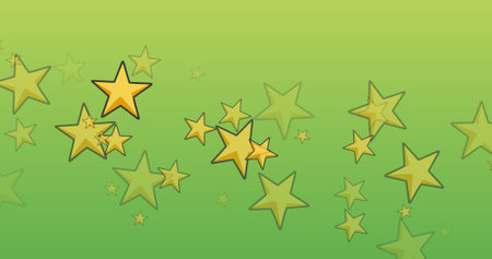 Digital composite of yellow star shapes with copy space on green background. christmas celebration and designs.の写真素材