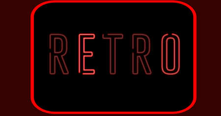 Digital composite image of illuminated neon retro text in red over black background. symbol and creativity.の写真素材