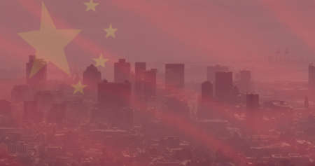 Image of flag of china over cityscape. chinese economy and business concept digitally generated image.の写真素材