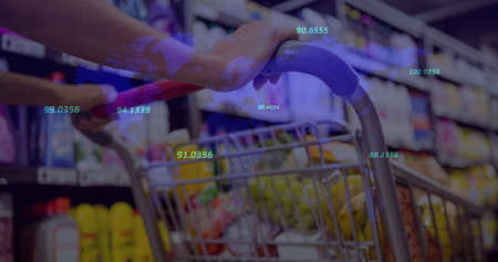 Image of statistics and financial data processing over woman pushing shopping trolley. finances, shopping, price rise and inflation concept digitally generated image.の写真素材