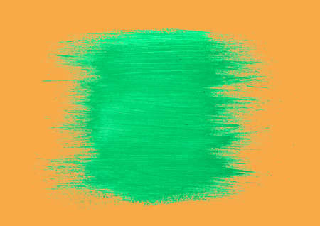 Digital generated image of green paint patch with copy space against orange background. st. patrick...
