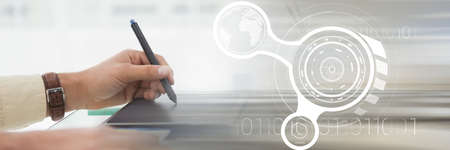 Cropped image of woman hand writing on a notepad at desk in office. with digital office interface concept background. digitally generated image.の写真素材