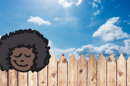 Woman face painting against wooden fence and clouds in the blue sky with copy space. business conceptの写真素材