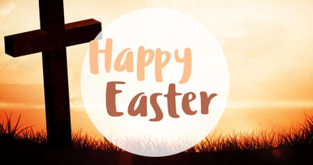 Happy easter symbol text by silhouette cross on grass against sky at sunset. digital composite, festive, symbol and creative concept.の写真素材