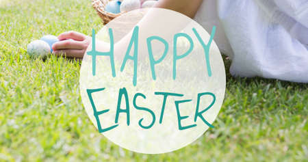 Happy easter symbol text over caucasian girl with eggs on grass. digital composite, festive, symbol...