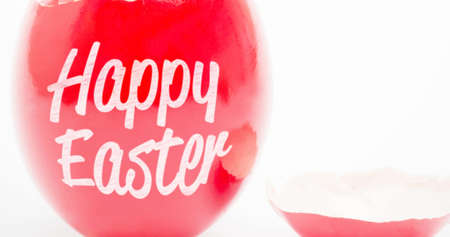 Image of happy easter text on easter egg on white background. easter sunday and celebration concept digitally generated image.の写真素材