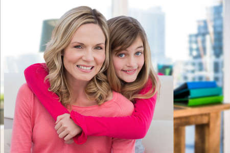 Composite image of caucasian mother and daughter smiling against office in background. motherhood and love conceptの写真素材