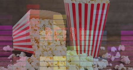 Image of retro text over boxes of popcorn. popcorn day and celebration concept digitally generated image.の写真素材