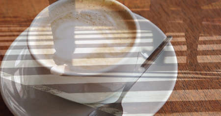 Image of light trails over cup of coffee. global business, finances, connections and digital interface concept digitally generated image.の写真素材