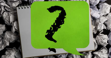 Image of question mark in speech bubble over notebook. education, knowledge and school concept...