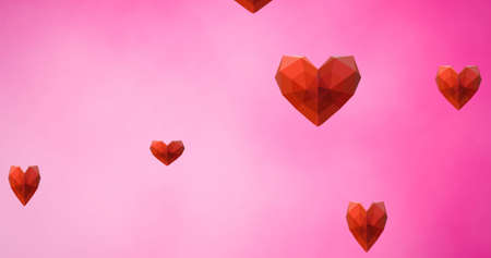 Image of hearts falling on pink background. heart month and celebration concept digitally generated...