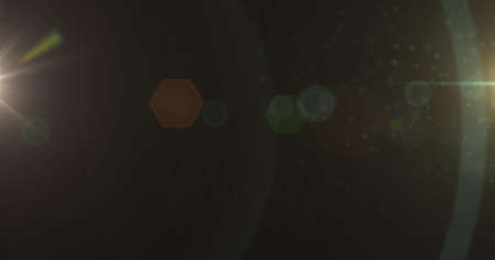 Image of green glowing light on brown background. light and movement concept digitally generated...