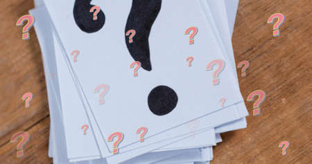 Image of question marks on wooden background. education, knowledge and school concept digitally generated image.の写真素材