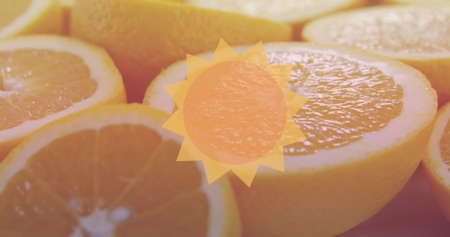 Image of sun icon over oranges. national vegetarian week and celebration concept digitally generated image.の写真素材