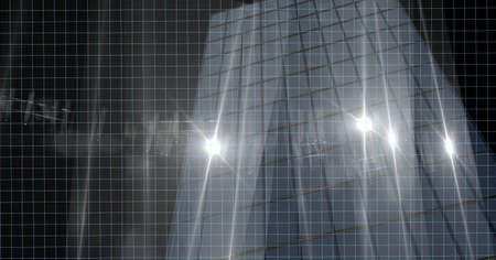 Spots of lights over tall building model against black background. modern architecture and engineering conceptの写真素材