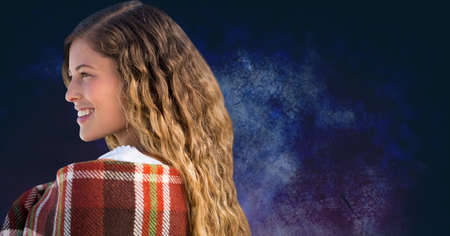 Side view of a caucasian woman smiling against copy space on textured blue background. family...