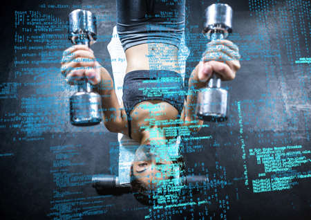 Composite image of data processing against african american fit woman working out at the gym. sports fitness and technology conceptの写真素材