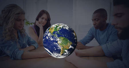 Composition of globe over business people using smartphones. global digital interface, technology...