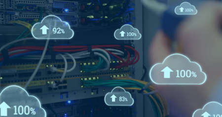 Image of clouds with increasing numbers over hands of caucasian man working with servers. cloud...