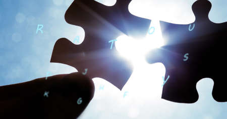 Image of puzzle pieces and letters falling over blue background. national puzzle day and games concept digitally generated concept.の写真素材