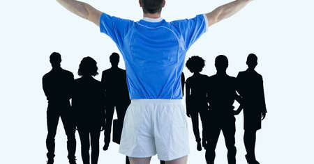 Rear view of male athlete celebrating against silhouette of group of people on white background....