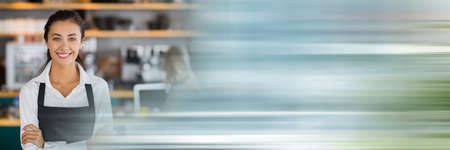 Blurred effect with copy space against portrait of caucasian waitress smiling at a restaurant. restaurant business conceptの写真素材