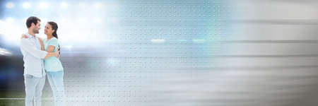Blurred effect with copy space against caucasian couple hugging each other and sports stadium. love,...