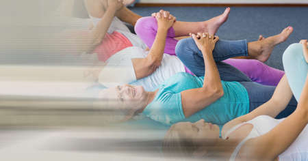Blur effect with copy space against female yoga trainer and group of senior people performing yoga. yoga, meditation and retirement home conceptの写真素材