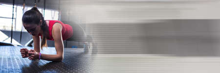 Blur effect with copy space against caucasian fit woman performing plank exercise at the gym. sports...