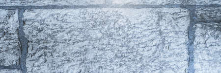 Spots of light over grey brick wall background with copy space. background with abstract texture and design conceptの写真素材