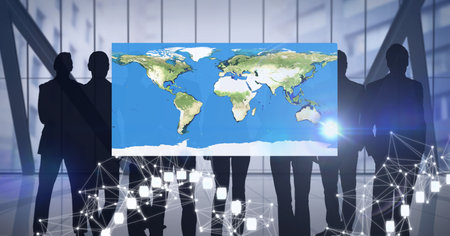 Network of connections over world map against silhouettes of businesspeople. global networking and...