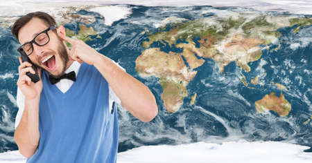 Caucasian man talking on smartphone against world map in background. global networking and...