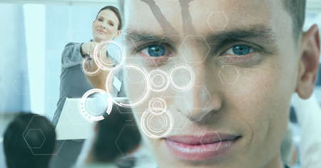 Multiple scope scanning over portrait of caucasian man against caucasian businesswoman at office. business and technology conceptの写真素材