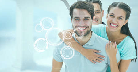 Multiple round scanners over portrait of caucasian family smiling against blue background. technology and family conceptの写真素材