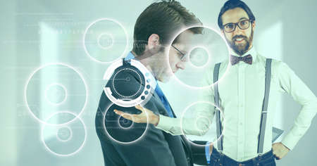 Multiple round scanners over man holding an invisible object against caucasian businessman. business and technology conceptの写真素材