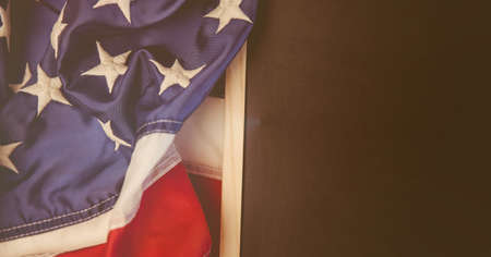 Close up view of american flag on wooden surface with copy space. american independence and...
