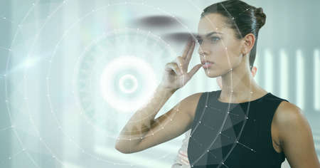 Round scanner over caucasian businesswoman touching invisible glasses against white background....
