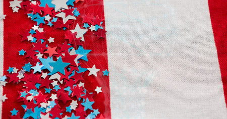 Multiple colorful stars over american flag background with copy space. american independence and patriotism conceptの写真素材