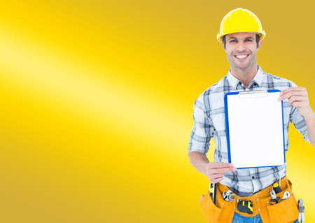 Caucasian male architect holding a clipboard against copy space on yellow gradient background. architecture and engineering conceptの写真素材