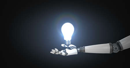 Digitally generated image of robotic hand presenting illuminated bulb against black backgroundの写真素材
