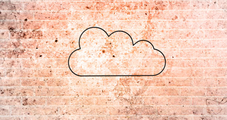Image of glowing neon cloud icon on brick wall. social media and communication concept digitally generated image.の写真素材