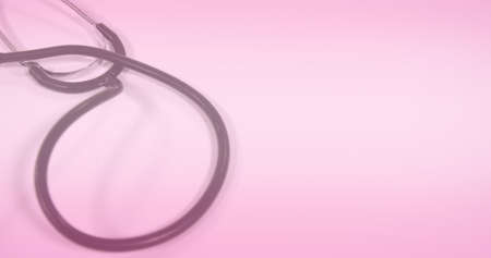 Image of hearts falling over stethoscope on pink background. medicine and healthcare services concept digitally generated image.の写真素材
