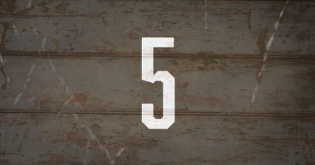 Digital composite of coutdown image with sparks against ruined wall in backgroundの写真素材
