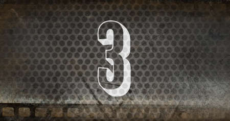 3d countdown image sizzling against a grey fence in backgroundの写真素材