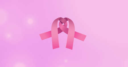 Image of pink ribbon over pink background. breast cancer positive awareness campaign concept...