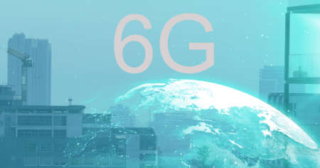 6g text and spinning globe against aerial view of cityscape. global networking and technology conceptの写真素材