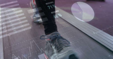 Image of legs of person walking on treadmill and data processing. global sport technology networking concept digitally generated image.の写真素材